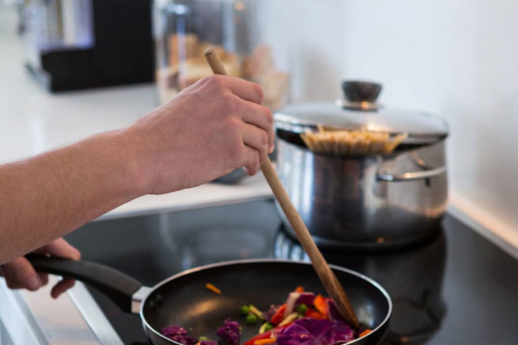 Hand of a man preparing food in kitchen Hand of a man preparing food in kitchen at home