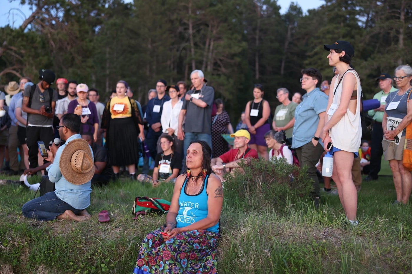 Winona LaDuke of Honor the Earth prays by the water as part of the multifaith delegation to the Stop Line 3 Treaty People Gathering. June 5, 2021.