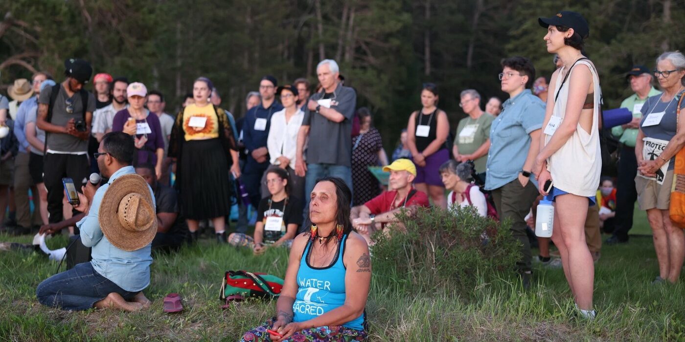 Winona LaDuke of Honor the Earth prays by the water as part of the multifaith delegation to the Stop Line 3 Treaty People Gathering. June 5, 2021.